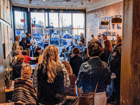 People gathered at a Logan County Chamber Event held at Native Coffee Co.
