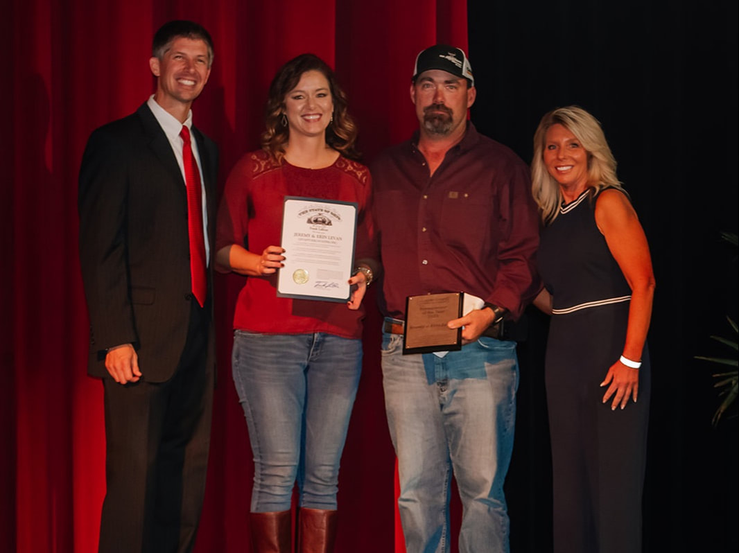 The 2022 Entrepreneur of the Year Award being given to Jeremy & Erin LeVan, owners of LeVan Excavating, Inc.